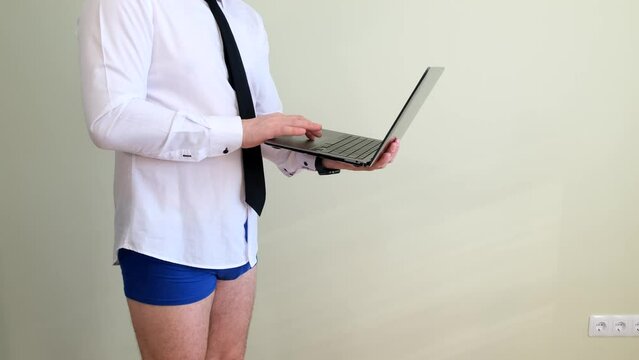 A businessman who stays at home during quarantine, talks on Skype, meetings with the boss