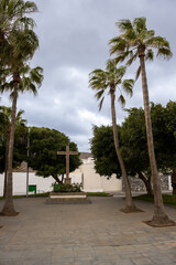 Fototapeta na wymiar Cross in a park with palms, Antigua, Fuerteventura
