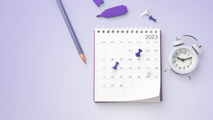 Calendar 2023 with pinned date, stationery and clock on pastel purple background