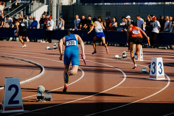 start running men relay race in athletics competition - obrazy, fototapety, plakaty