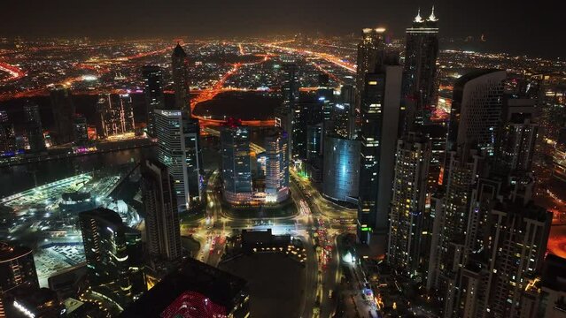 Panoramic aerial view of Downtown Dubai skyline buildings, luxury hotels at night