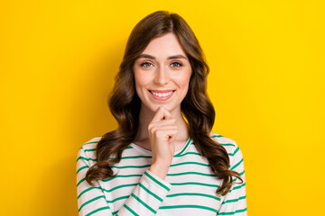 Fototapeta premium Portrait photo of cheerful satisfied smart positive woman touch chin creative plan genius solution clever idea isolated on yellow color background