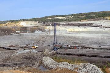 An interesting appearance of an open surface mine. Conveyor belt at a coal mine. A panoramic view...