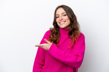 Young caucasian woman isolated on white background presenting an idea while looking smiling towards