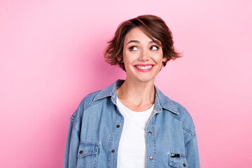 Fototapeta premium Portrait of young attractive girl model look interested empty space open bar restaurant wear trendy denim jacket isolated on pink color background