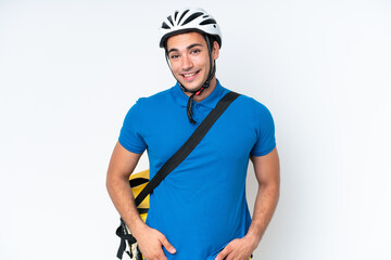 Young caucasian man with thermal backpack isolated on white background laughing