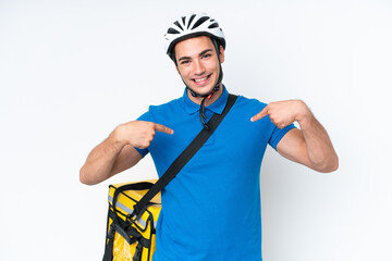 Young caucasian man with thermal backpack isolated on white background proud and self-satisfied