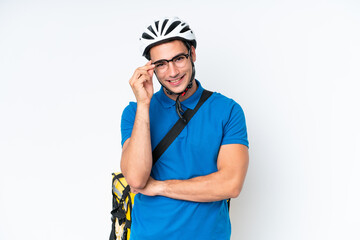 Young caucasian man with thermal backpack isolated on white background with glasses and happy