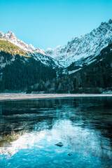 Awesome Sunny Day. Hiking Trail near famous Lake Popradske Pleso. Incredible mountains Scenery, Popular travel destination. High Tatras. Slovakia. Wonderful Nature Landscape in winter months.