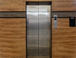 Photo of a classic metal-colored elevator © ffrinat