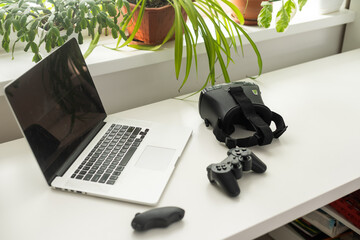 VR glasses and laptop on a table