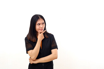 Thoughtful young asian business woman standing while looking beside on blank space. Isolated