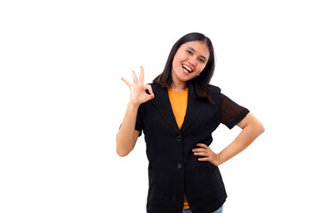 Cheerful young asian business woman standing while showing okay hand gesture. Isolated on white