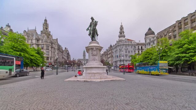 Liberdade square with monument of King Peter IV and Porto city hall, timelapse hyperlapse panoramic view at cloudy day, Porto, Portugal