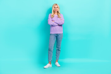 Full body portrait of calm focused pretty lady folded hands posing isolated on turquoise color background