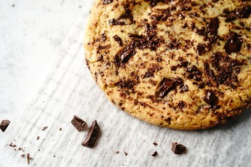 Homemade giant single serve chewy chocolate chip cookie, selective focus
