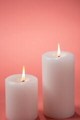 ピンクの背景とキャンドル
