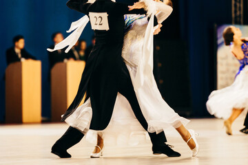 сouple of dancers man and woman dance waltz