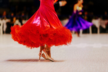 female dancer in red ball gown for dance competition