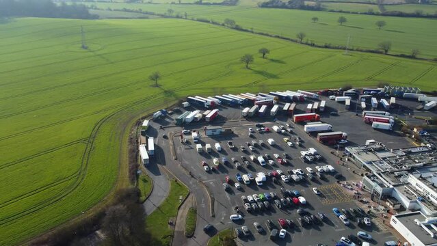 Aerial Footage of British Motorways with Traffic at Services Stop of Toddington Near to Luton Town of England UK. The Footage was Captured During The Day of 15 Feb 2023 with Drone's Camera