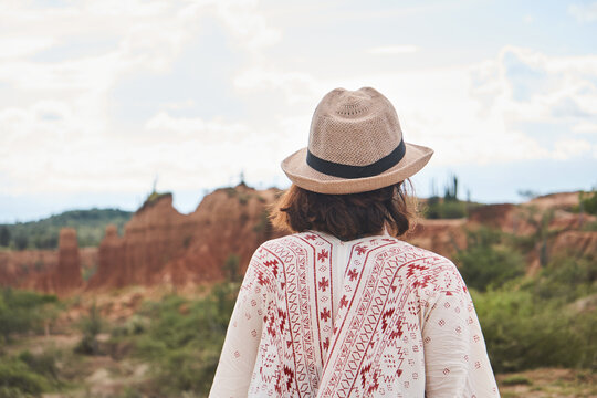 Anonymous woman standing in desert