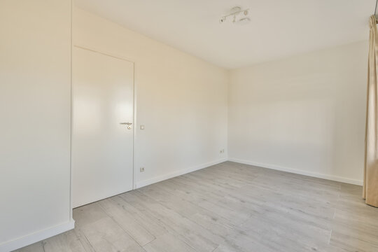 Room with white walls and door