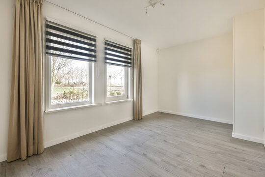 Windows with curtains in empty room