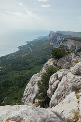 Fototapeta na wymiar mountainous terrain rocks view from above in nature green forest below