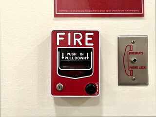 fire alarm system on the ivory cement wall background in the hospital to alarm fire accident 