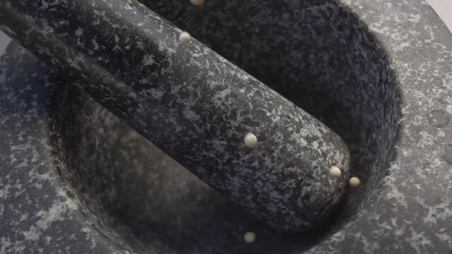 White pepper poured into a mortar