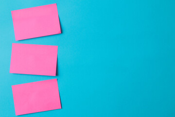 Multicolored various notes or sticky post-it on a blue background.mockup