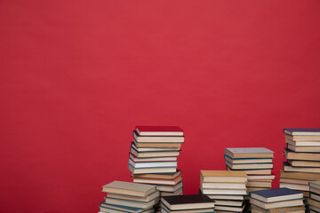 reading science knowledge many books stacked in the library on a red background