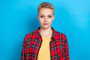 Fototapeta premium Portrait of confident college student lady smart casual outfit wear plaid shirt serious face freelancer job worker isolated on blue color background