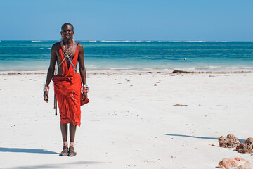 Maasai warrior on the beach Diani Beach, Kenya Mombasa