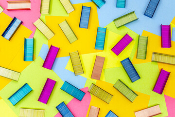 Multicolored office metal staples for stapler on multicolored paper Sticky Notes