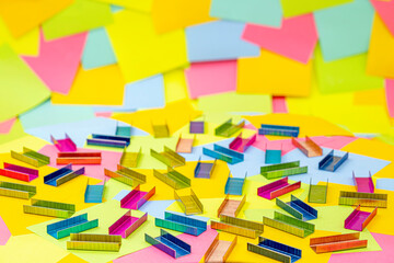 Multicolored office metal staples for stapler on multicolored paper Sticky Notes