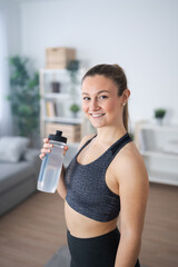 Portrait of sportswoman looking at camera