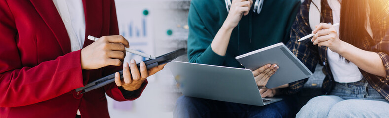 Financial analysts analyze business financial reports on a digital tablet planning investment project during a discussion at a meeting of corporate showing the results of their successful teamwork.