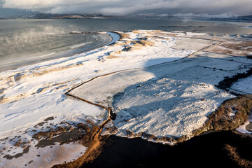 Aerial view of the snow covered Narin Portnoo Golf links in County Donegal, Ireland