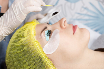woman undergoing eyelash tinting and lamination procedure