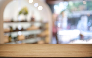 Empty wooden table in front of abstract blurred background of coffee shop . can be used for display or montage your products.Mock up for display of product