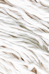 macro white rope background,The turns of the white twisted nylon ship rope close up