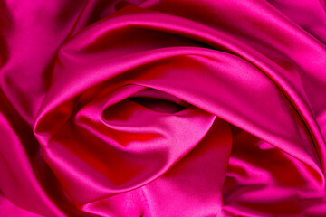 Textile background. Pink silk. Close-up. Top view.