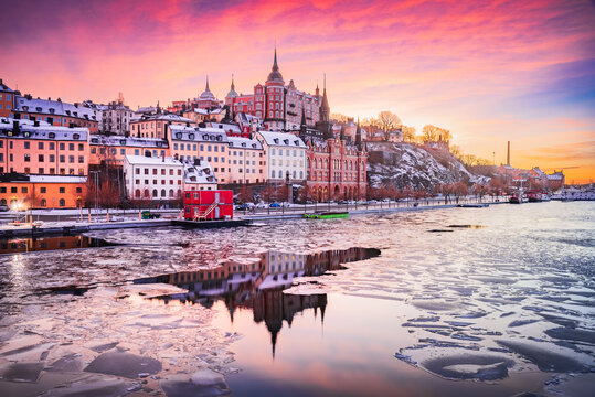 Stockholm, Sweden. Sunset with  Mariaberget downtown  and frozen Lake Malaren