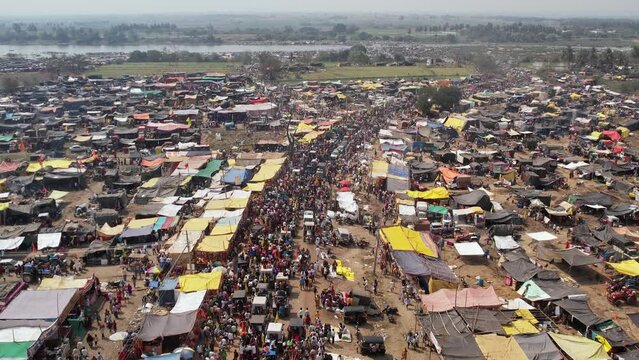 Aerial view of a huge crowd of people moving on the busy road during the Hindu religious festival