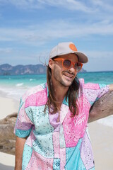 portrait of a man on the beach in krabi thailand with sunglasses, poda island, model shooting 