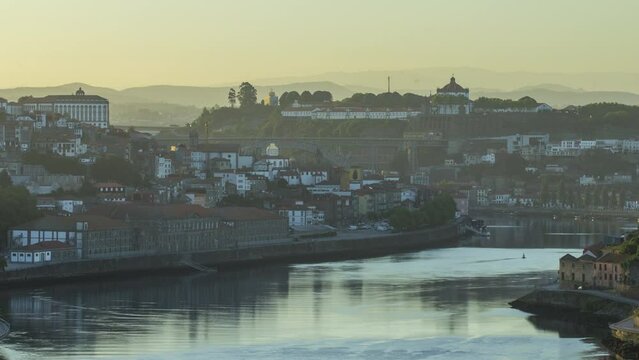 Aerial morning view arter sunrise at the most emblematic area of Douro river timelapse with Mosteiro da Serra do Pilar on background. World famous Porto wine production area.