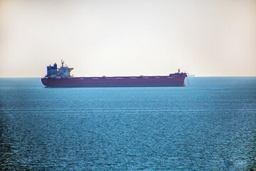 a red ship is anchored in the roadstead in the Black Sea	
