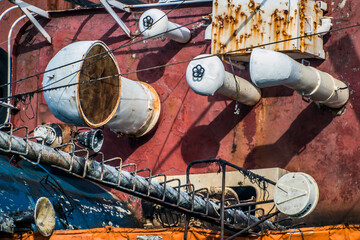Pipes on the deck of a semi sunken ship closeup	
