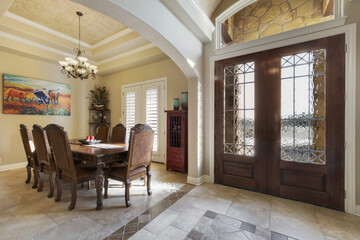 Home entrance with a dining room 